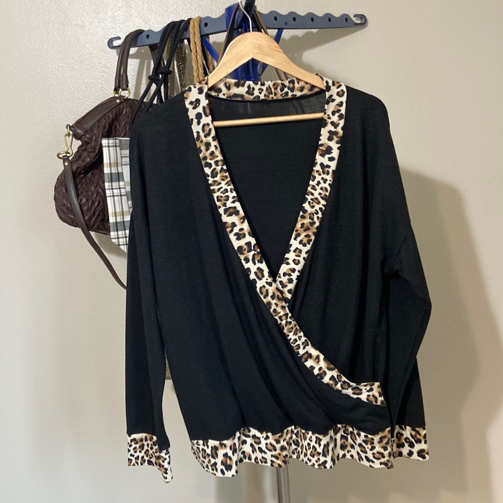 60. Animal Print Faux Wrap Top- ptp: 27” l: 27”